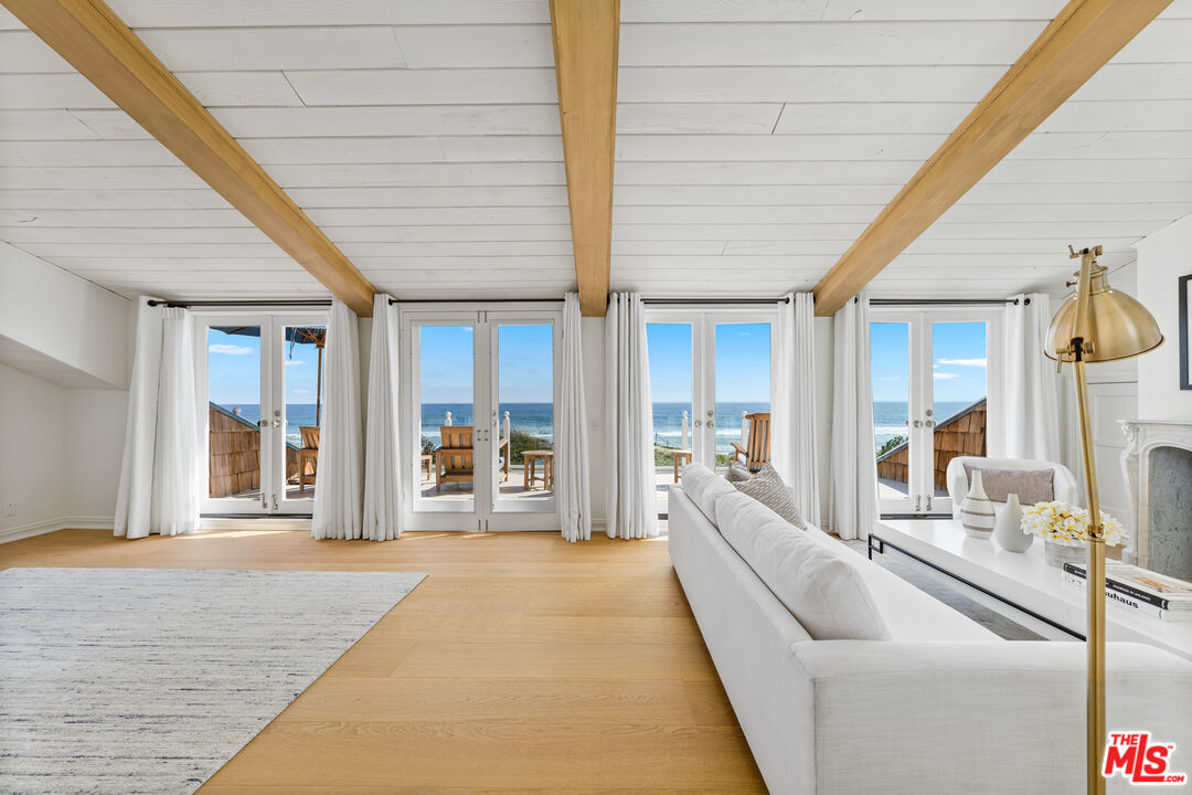 31202 Broad Beach Road Malibu, CA 90265 - Photo 16 of 38 a lobby with furniture and large windows