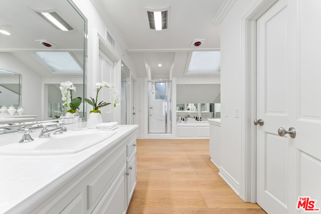 31202 Broad Beach Road Malibu, CA 90265 - Photo 18 of 38 a bathroom with a sink a mirror and a shower