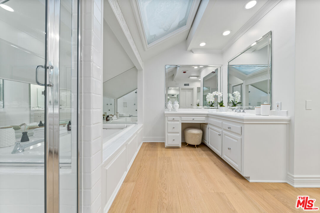 31202 Broad Beach Road Malibu, CA 90265 - Photo 19 of 38 a bathroom with a double vanity sink mirror and bathtub
