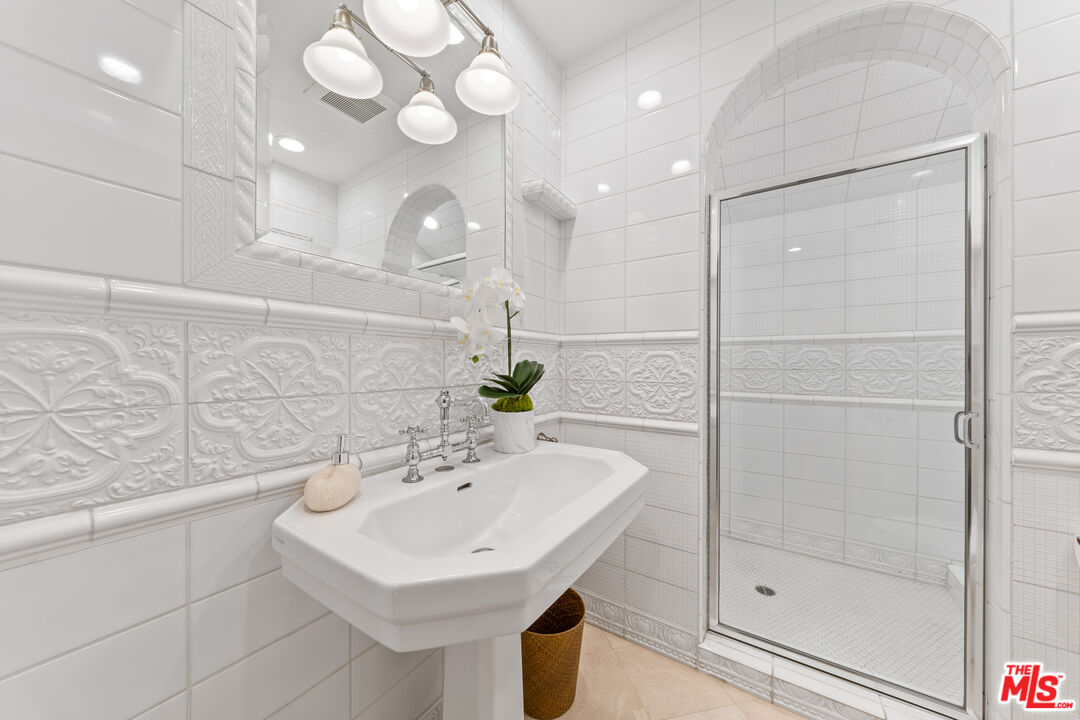 31202 Broad Beach Road Malibu, CA 90265 - Photo 22 of 38 a bathroom with a sink a toilet and shower