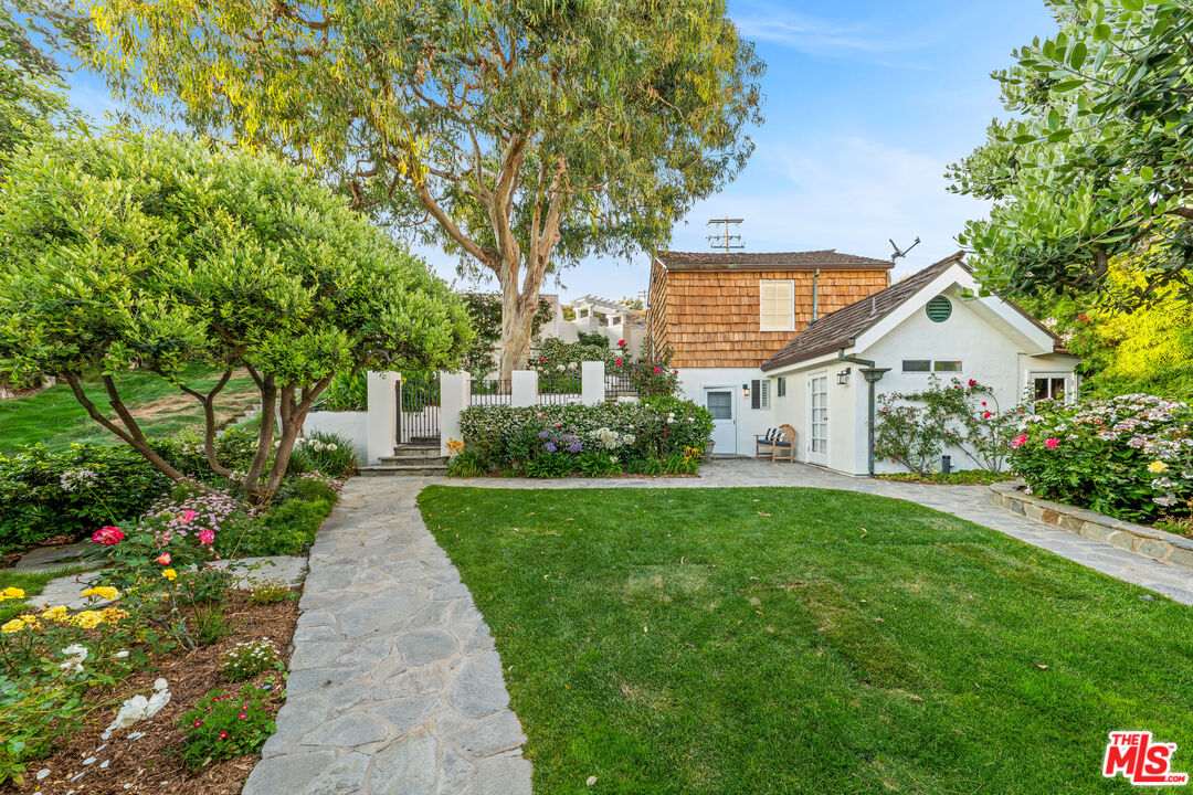 31202 Broad Beach Road Malibu, CA 90265 - Photo 26 of 38 a view of a house with a yard
