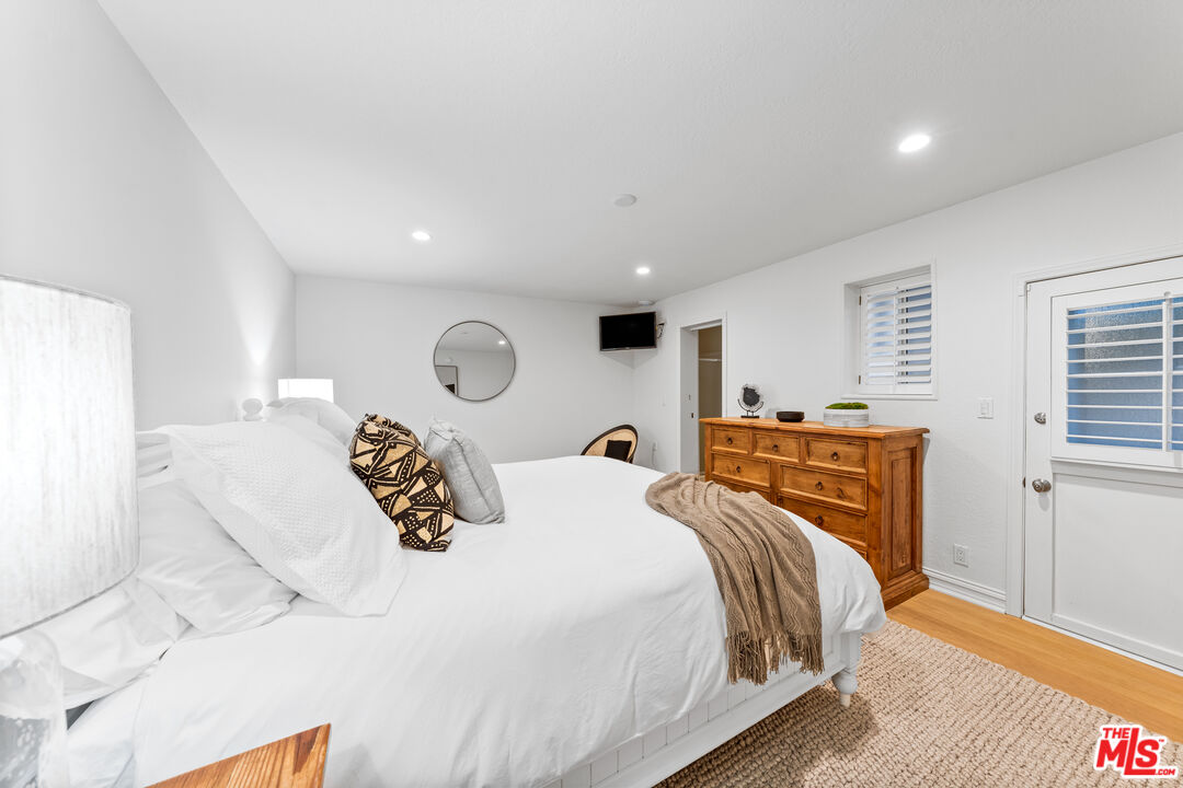 31202 Broad Beach Road Malibu, CA 90265 - Photo 27 of 38 a bedroom with a bed and a window