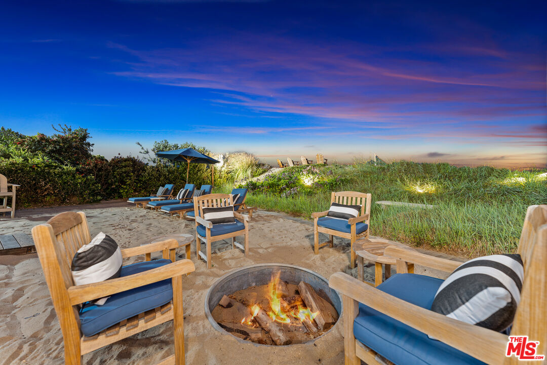 31202 Broad Beach Road Malibu, CA 90265 - Photo 35 of 38 a view of a swimming pool with lounge chairs
