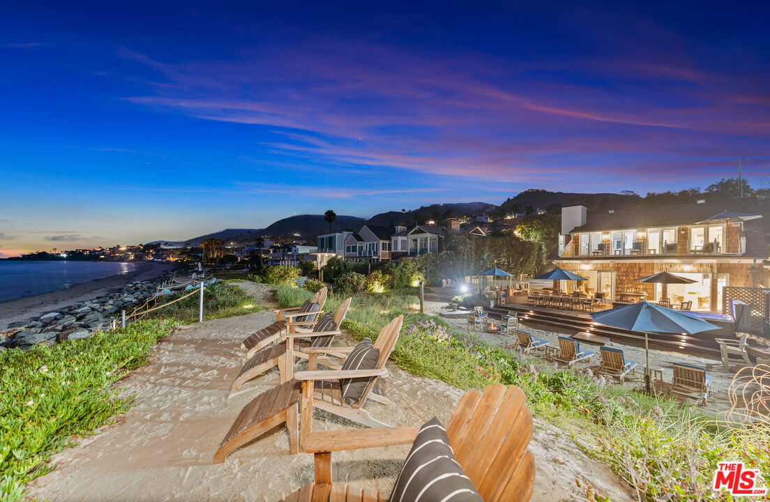 31202 Broad Beach Road Malibu, CA 90265 - Photo 36 of 38 a view of a lake with a table chairs and potted plants