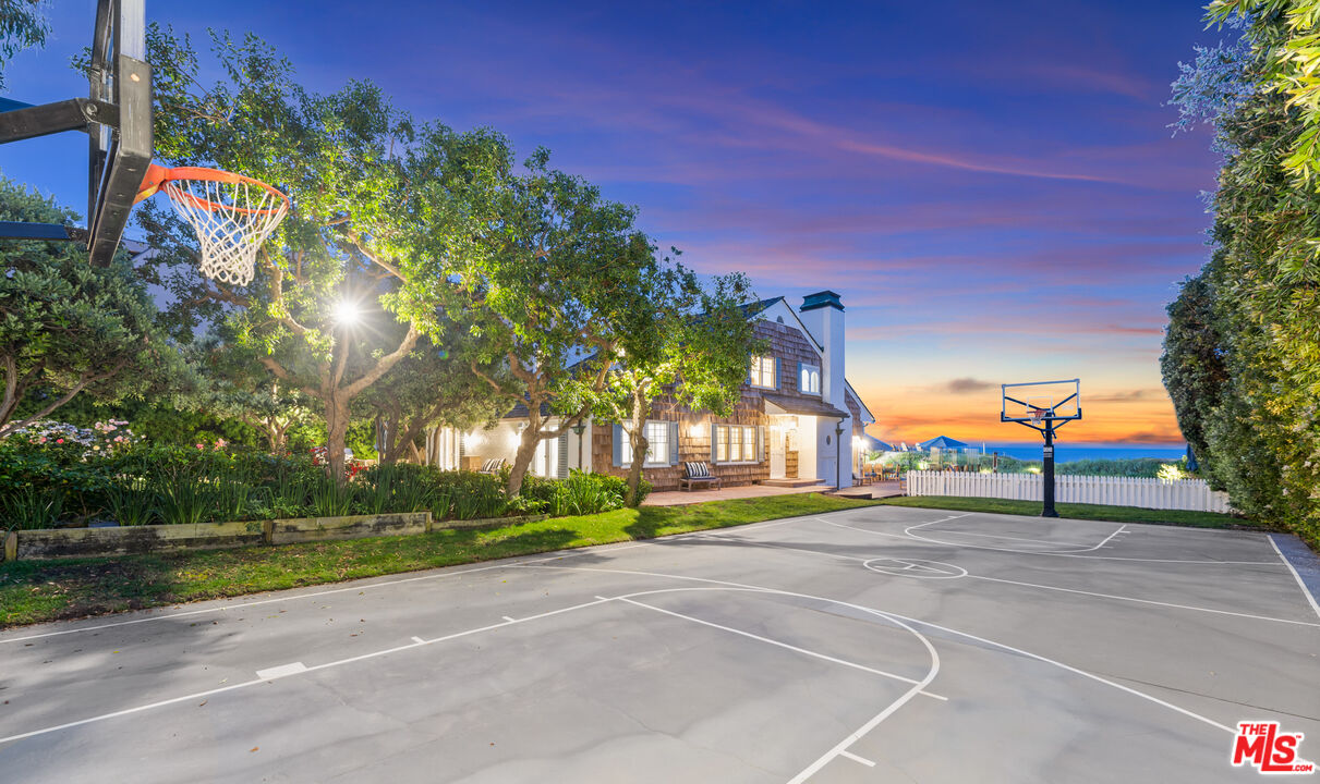 31202 Broad Beach Road Malibu, CA 90265 - Photo 4 of 38 a front view of a house with a yard and garage