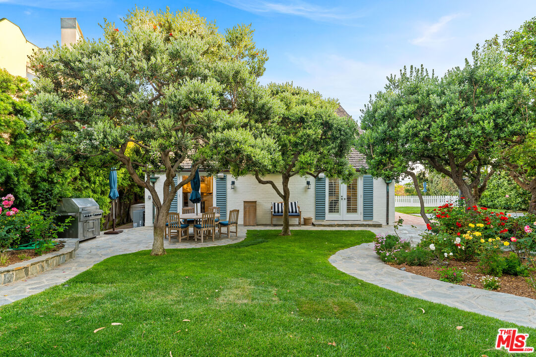 31202 Broad Beach Road Malibu, CA 90265 - Photo 6 of 38 a view of a house with backyard and a tree