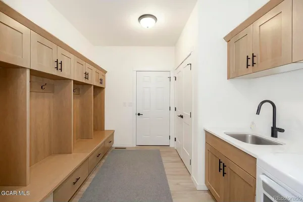a bathroom with a double vanity sink and a mirror