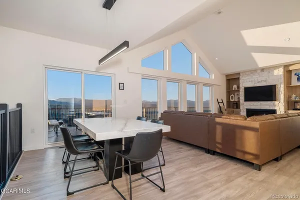 a view of a dining room with furniture window and wooden floor