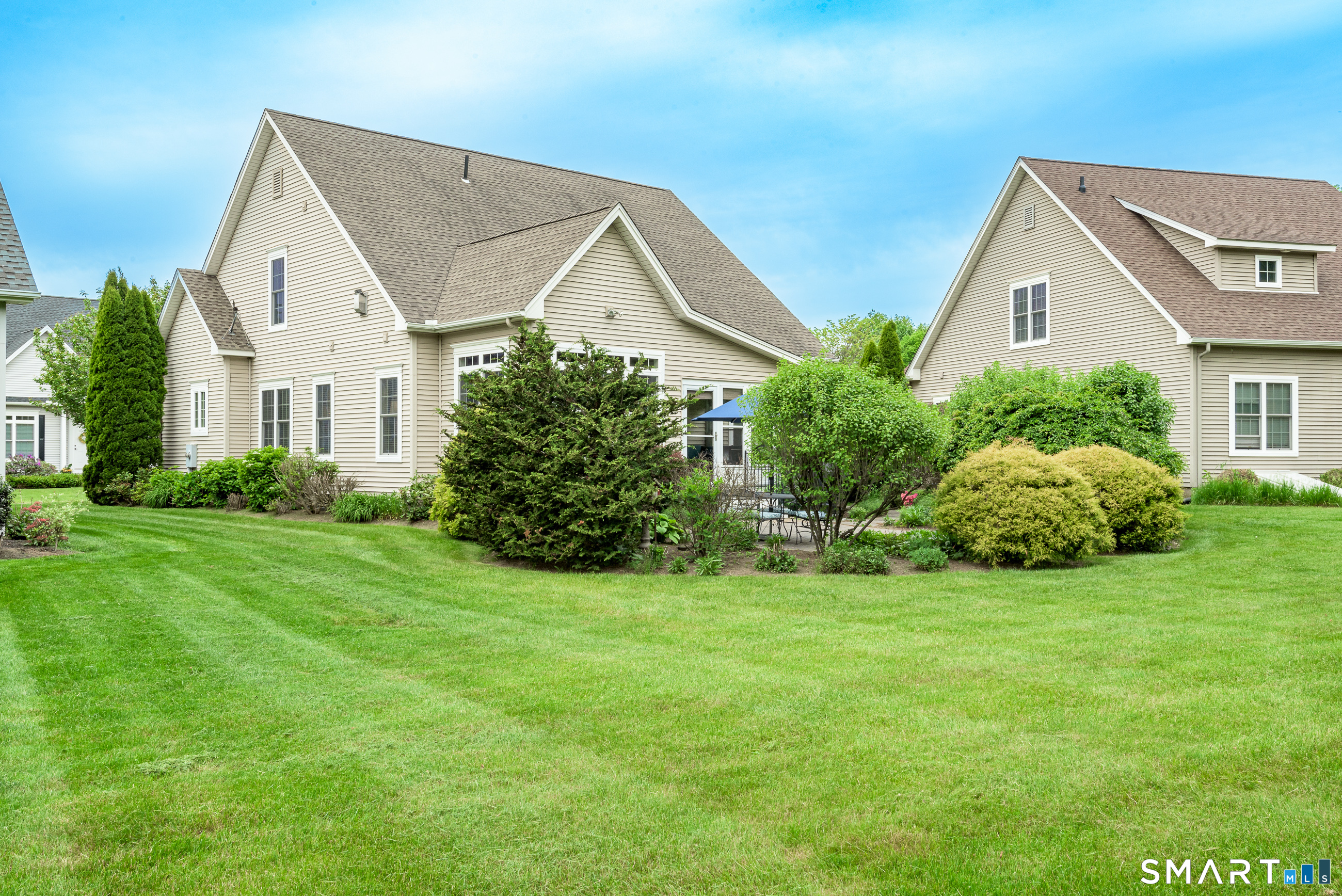 8 Greendale Drive, Unit 8 Suffield, CT 06078 - Photo 35 of 40 a view of a house with backyard and garden