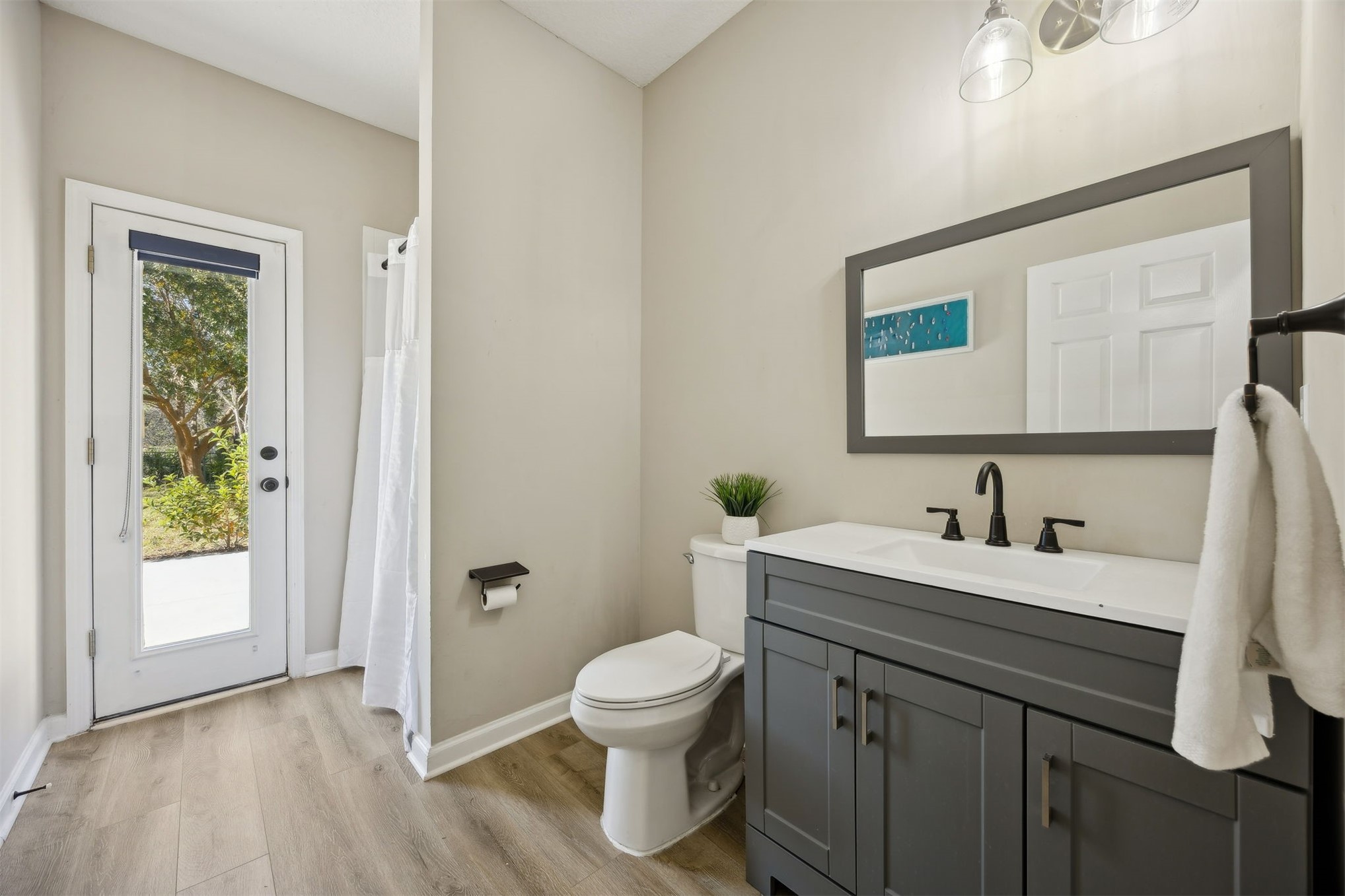 86126 Remsenburg Drive Fernandina Beach, FL 32034 - Photo 12 of 35 a bathroom with a toilet a sink and a mirror