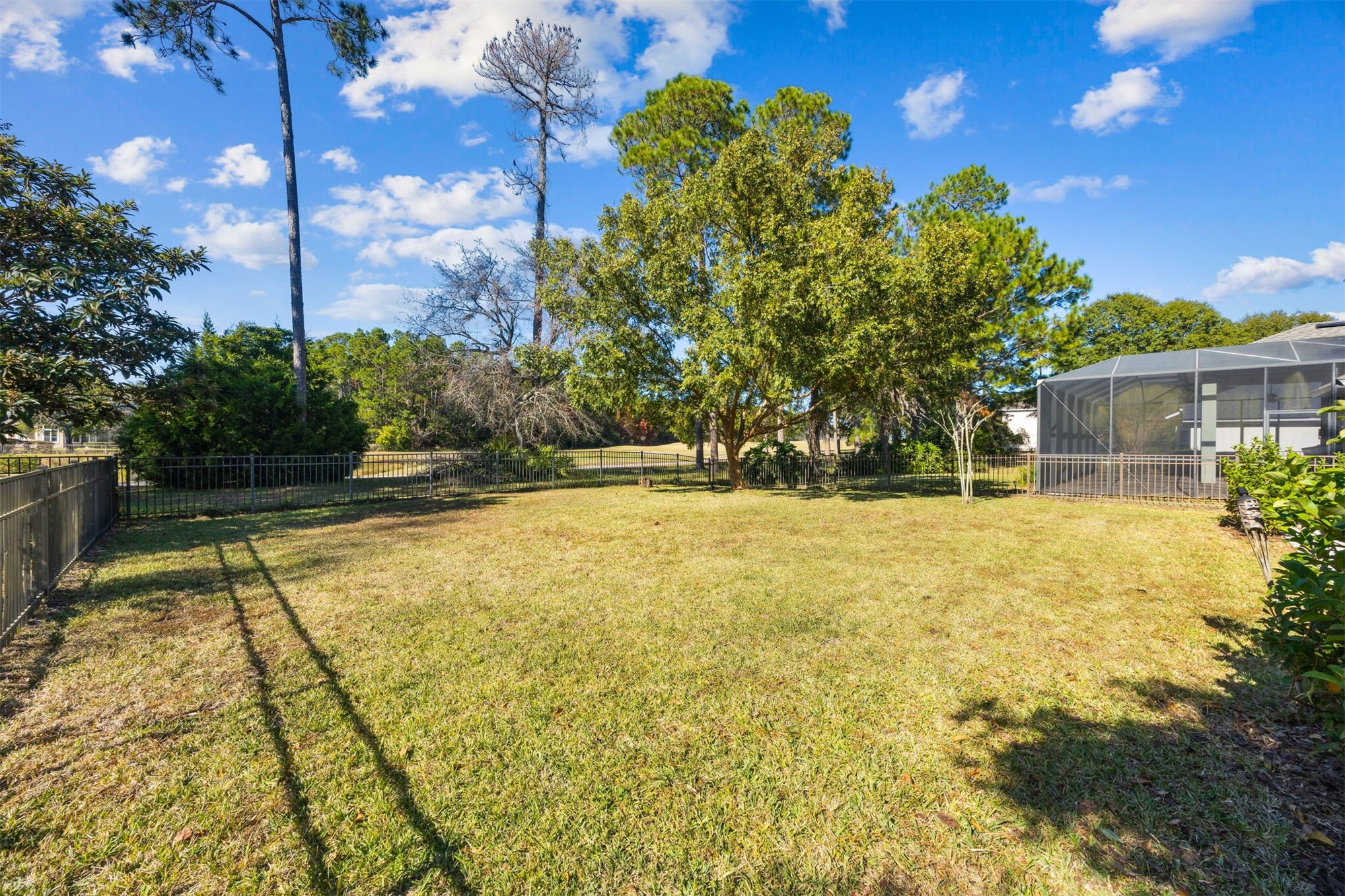 86126 Remsenburg Drive Fernandina Beach, FL 32034 - Photo 28 of 35 a swimming pool with trees in front of it