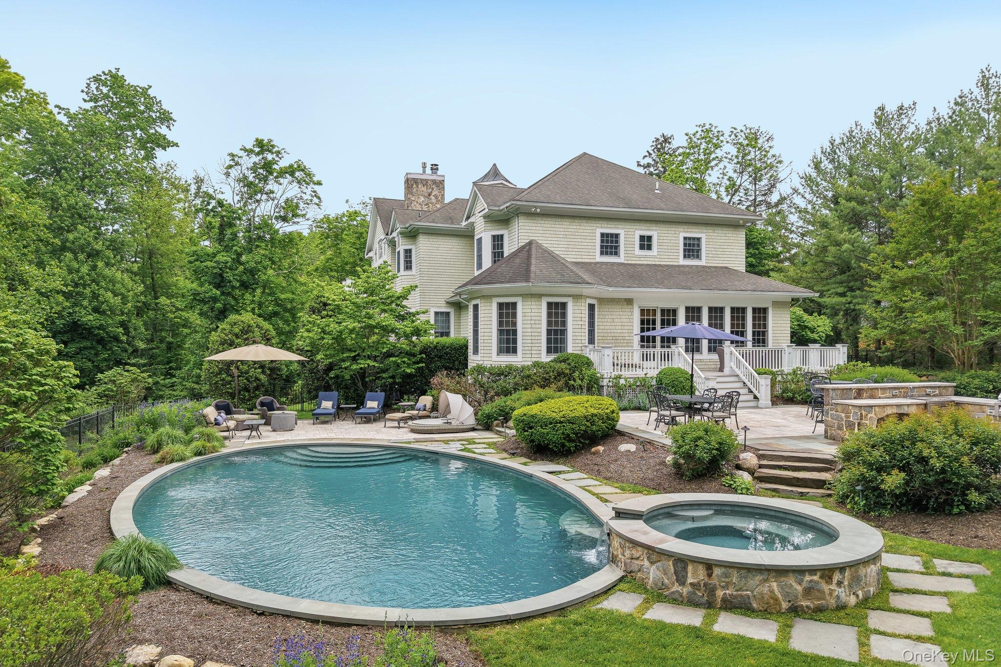 5 Mill Road Lloyd Harbor, NY 11743 - Photo 7 of 49 a view of a house with swimming pool and porch