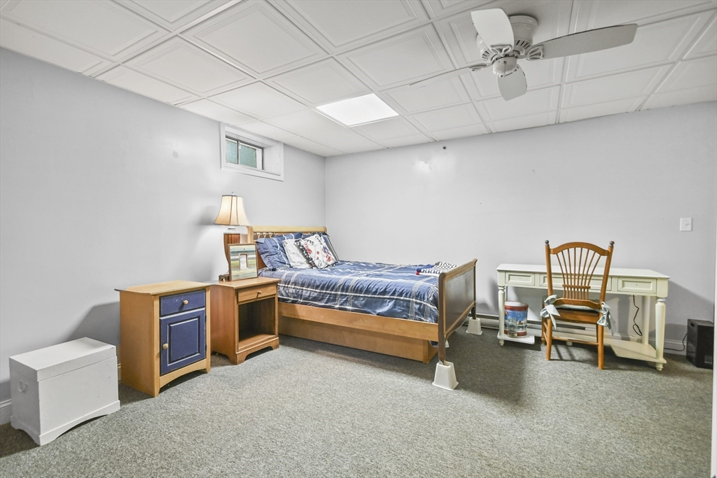 231 Georgetown Road Boxford, MA 01921 - Photo 17 of 28 a bedroom with furniture and natural light