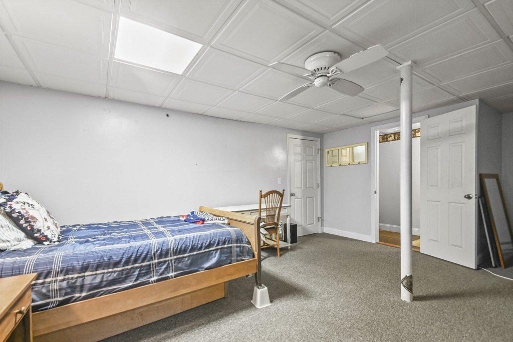 231 Georgetown Road Boxford, MA 01921 - Photo 18 of 28 a bedroom with a bed and a cabinet