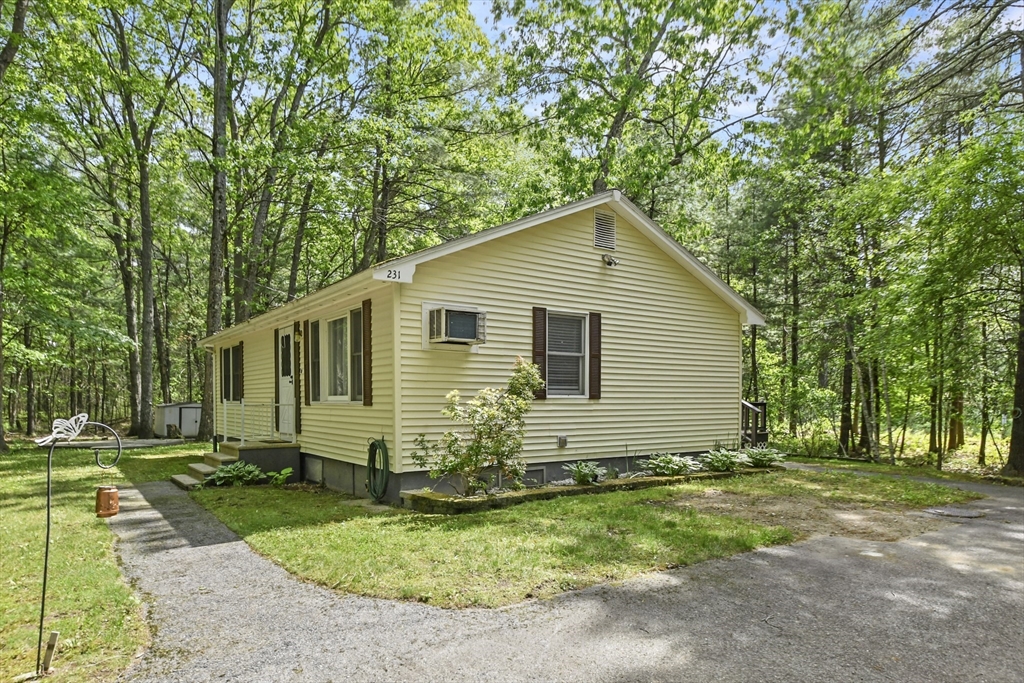 231 Georgetown Road Boxford, MA 01921 - Photo 2 of 28 a front view of house with yard and green space
