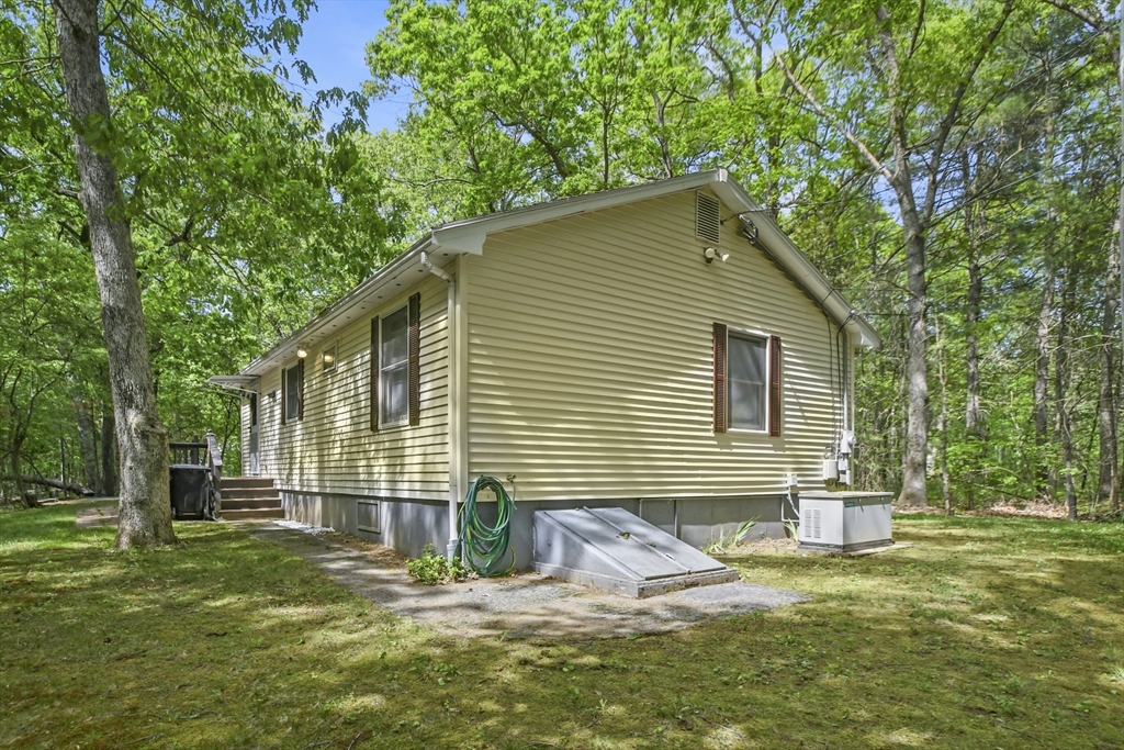 231 Georgetown Road Boxford, MA 01921 - Photo 23 of 28 a front view of a house with a garden