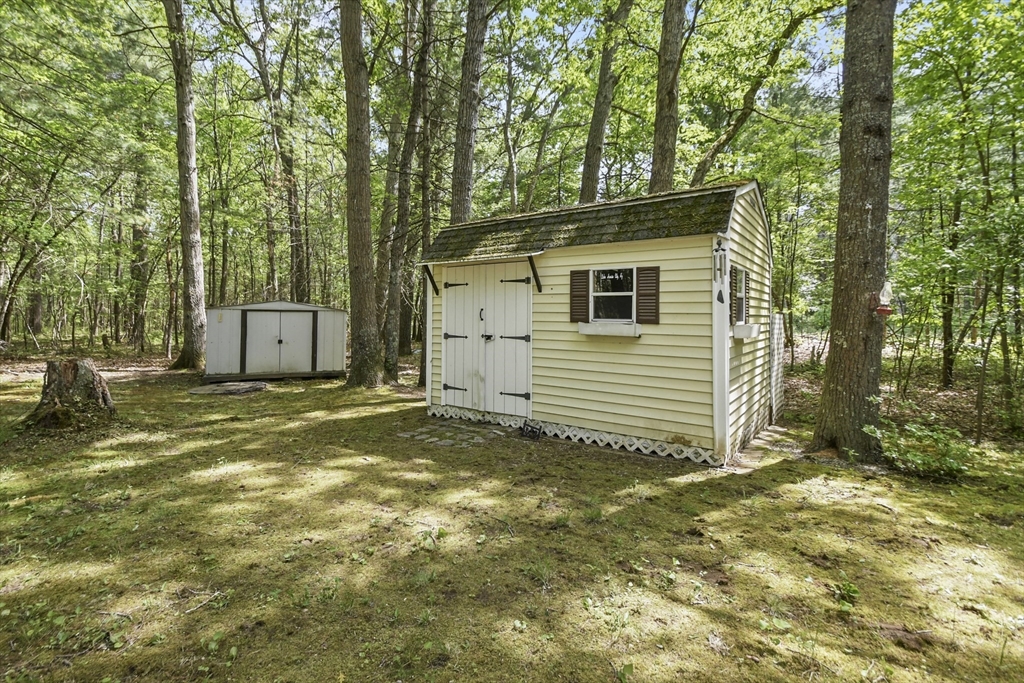 231 Georgetown Road Boxford, MA 01921 - Photo 25 of 28 a view of a house with backyard and trees
