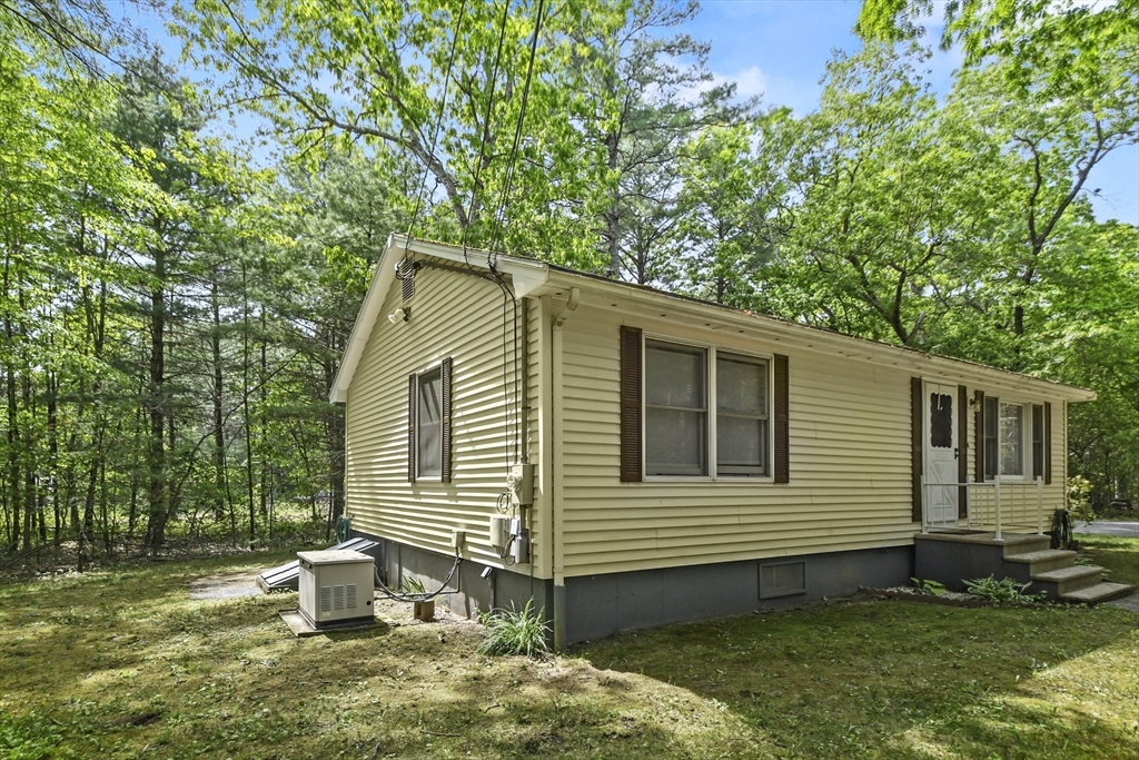 231 Georgetown Road Boxford, MA 01921 - Photo 26 of 28 a view of a house with a yard and a patio