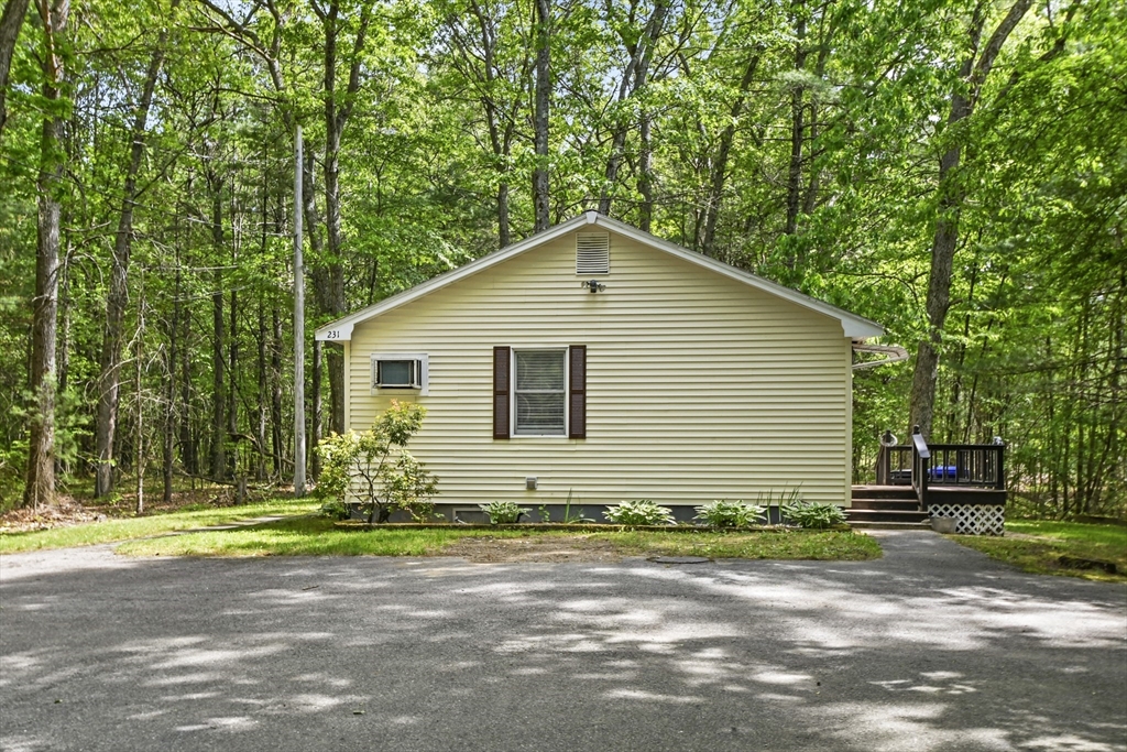 231 Georgetown Road Boxford, MA 01921 - Photo 27 of 28 a front view of a house with a yard