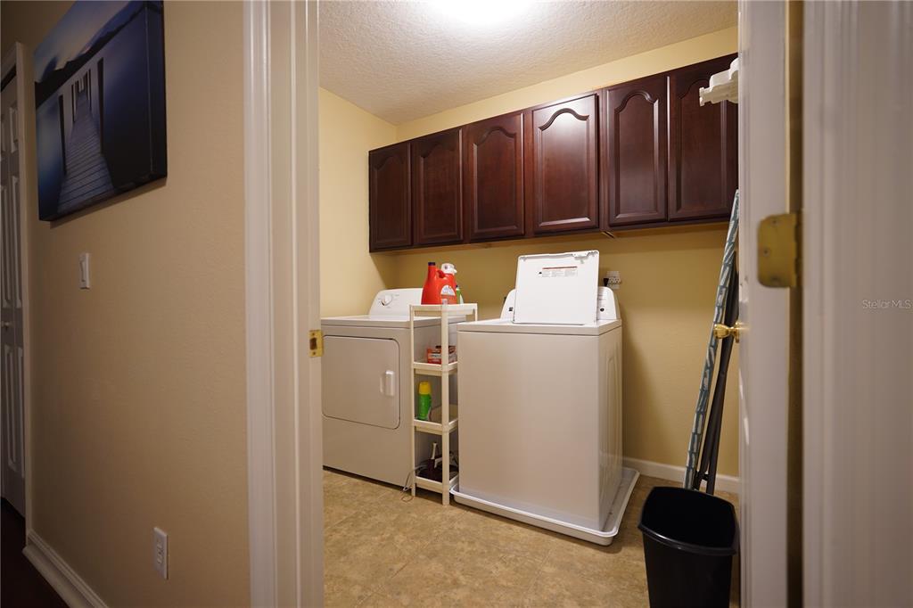 16307 Old Ash Loop Orlando, FL 32828 - Photo 19 of 23 a utility room with dryer and washer