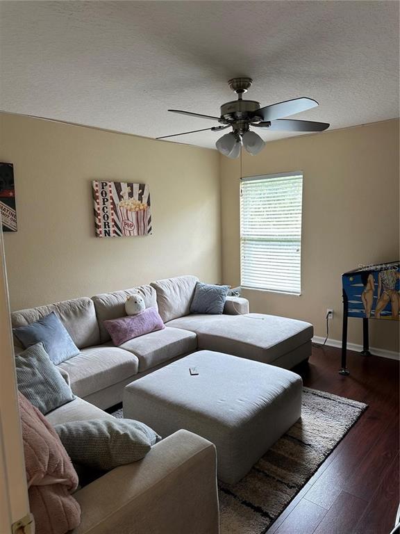 16307 Old Ash Loop Orlando, FL 32828 - Photo 23 of 26 a living room with furniture and a window