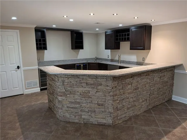 a view of a kitchen with kitchen island