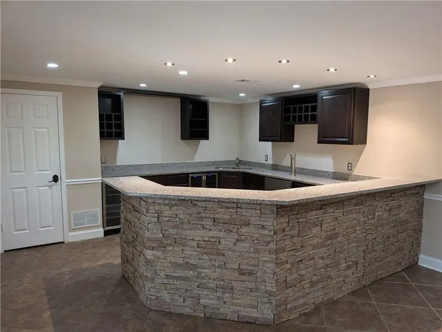 a view of a kitchen with microwave and cabinets