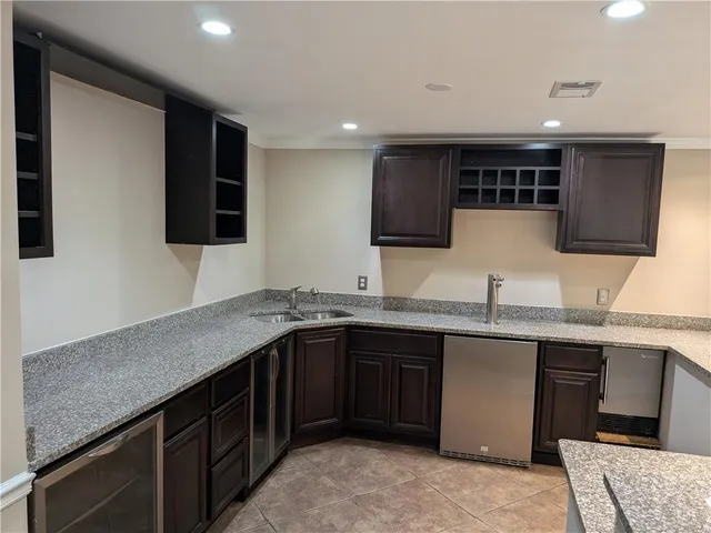 a kitchen with a sink and cabinets
