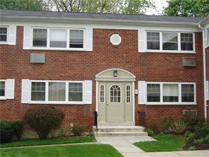 1879 Crompond Road, Unit G11 Peekskill, NY 10566 - Photo 1 of 1 a front view of a house with a yard
