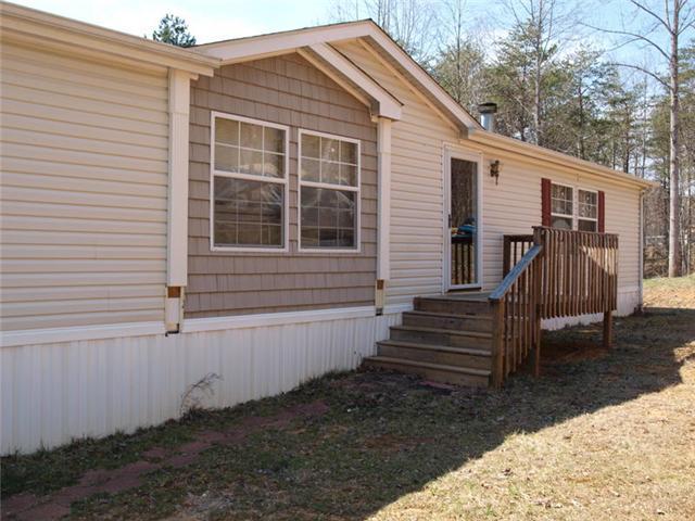 108 Westgrove Road Blue Ridge, VA 24064 - Photo 4 of 24 a view of a house with backyard and wooden fence