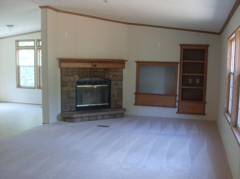 108 Westgrove Road Blue Ridge, VA 24064 - Photo 9 of 24 an empty room with a fireplace and window