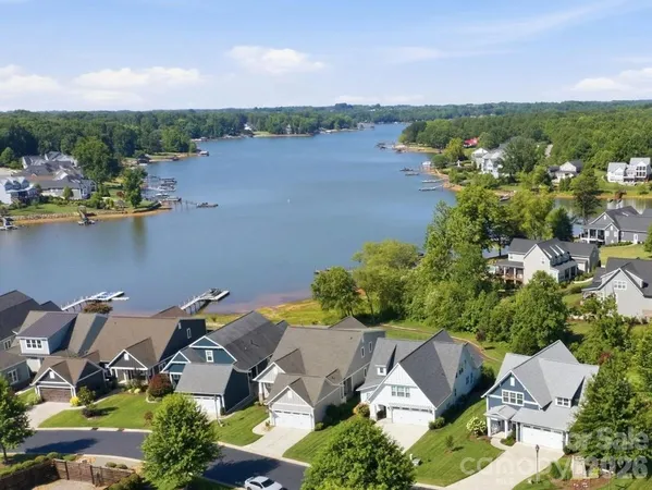 an aerial view of a house with a lake view