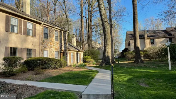 a view of a building with a yard