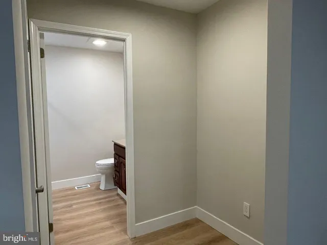 a bathroom view of a toilet and a sink
