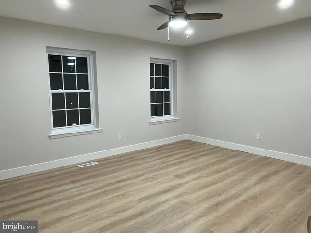 a view of empty room with windows