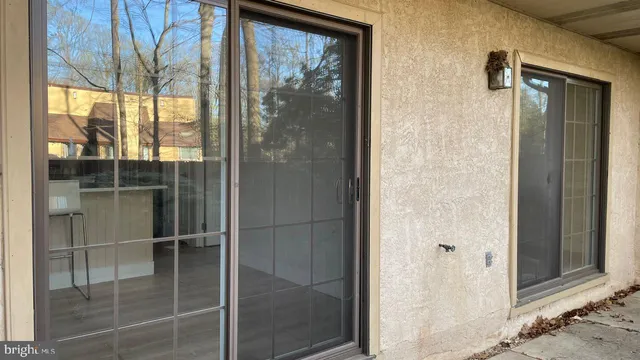 a bathroom with a glass shower door