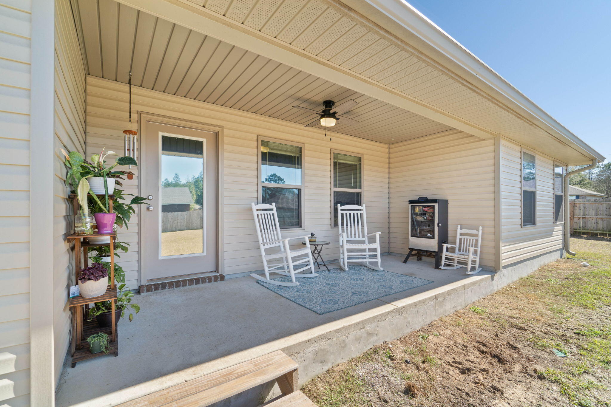 3633 Ranch Drive Crestview, FL 32539 - Photo 11 of 13 a dining room with furniture and a floor to ceiling window