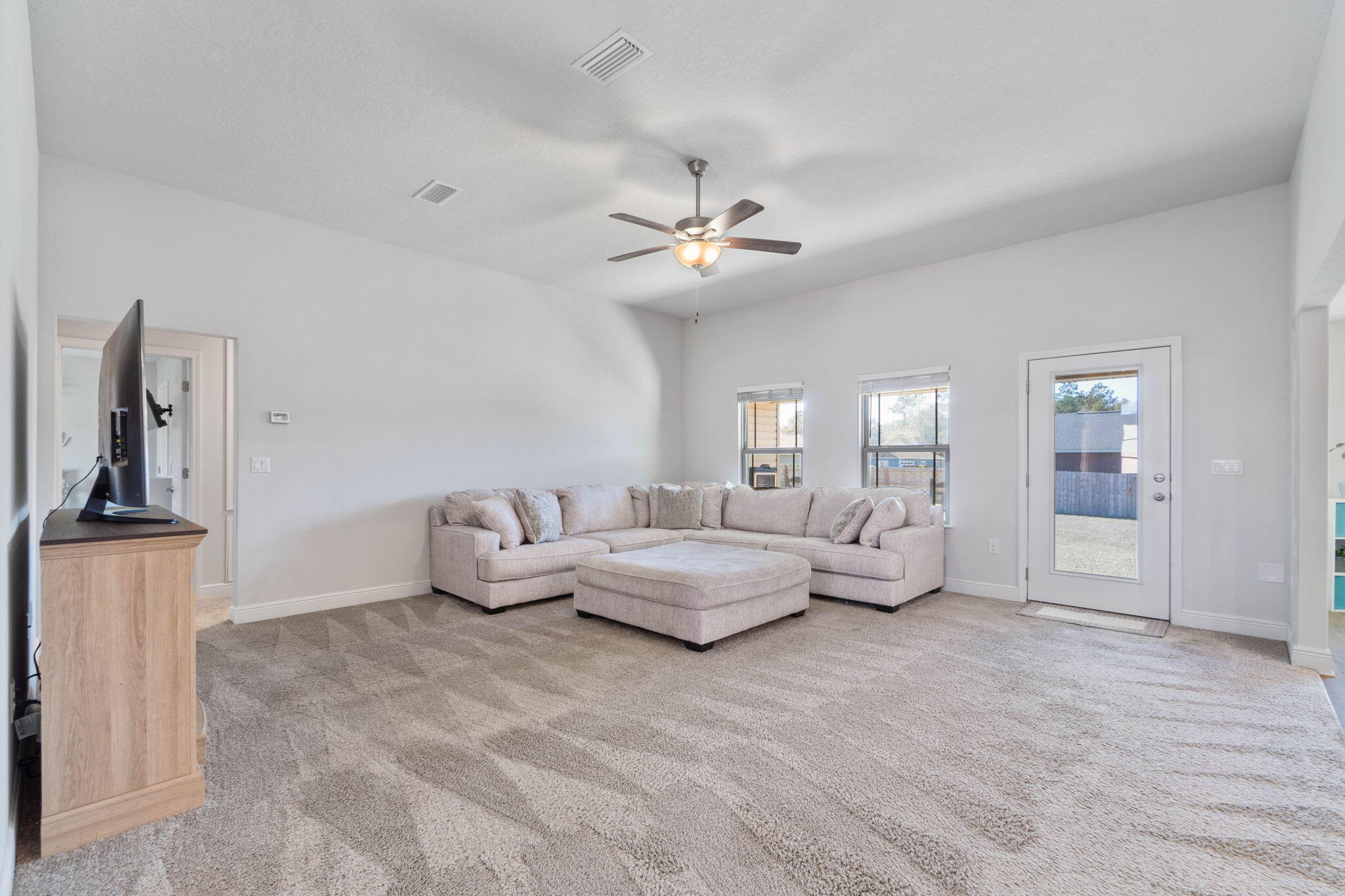 3633 Ranch Drive Crestview, FL 32539 - Photo 4 of 13 a living room with furniture chandelier and a window