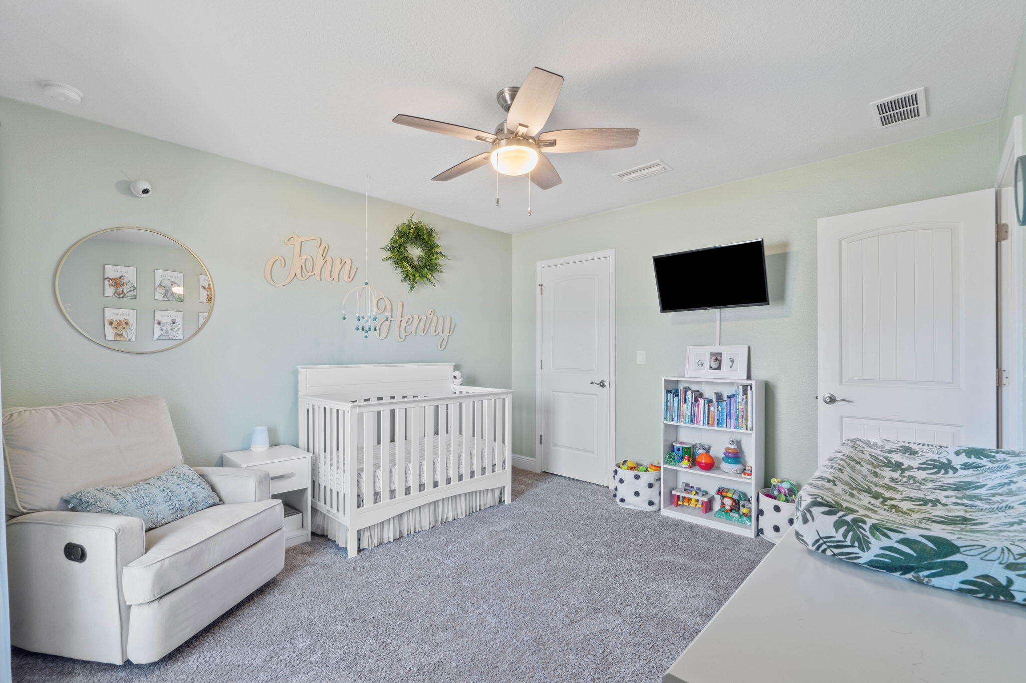 3633 Ranch Drive Crestview, FL 32539 - Photo 6 of 13 a bedroom with furniture and a flat screen tv