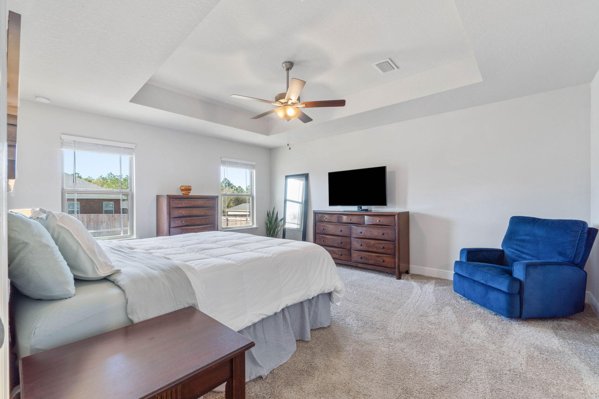 3633 Ranch Drive Crestview, FL 32539 - Photo 8 of 13 a bedroom with a bed and a television