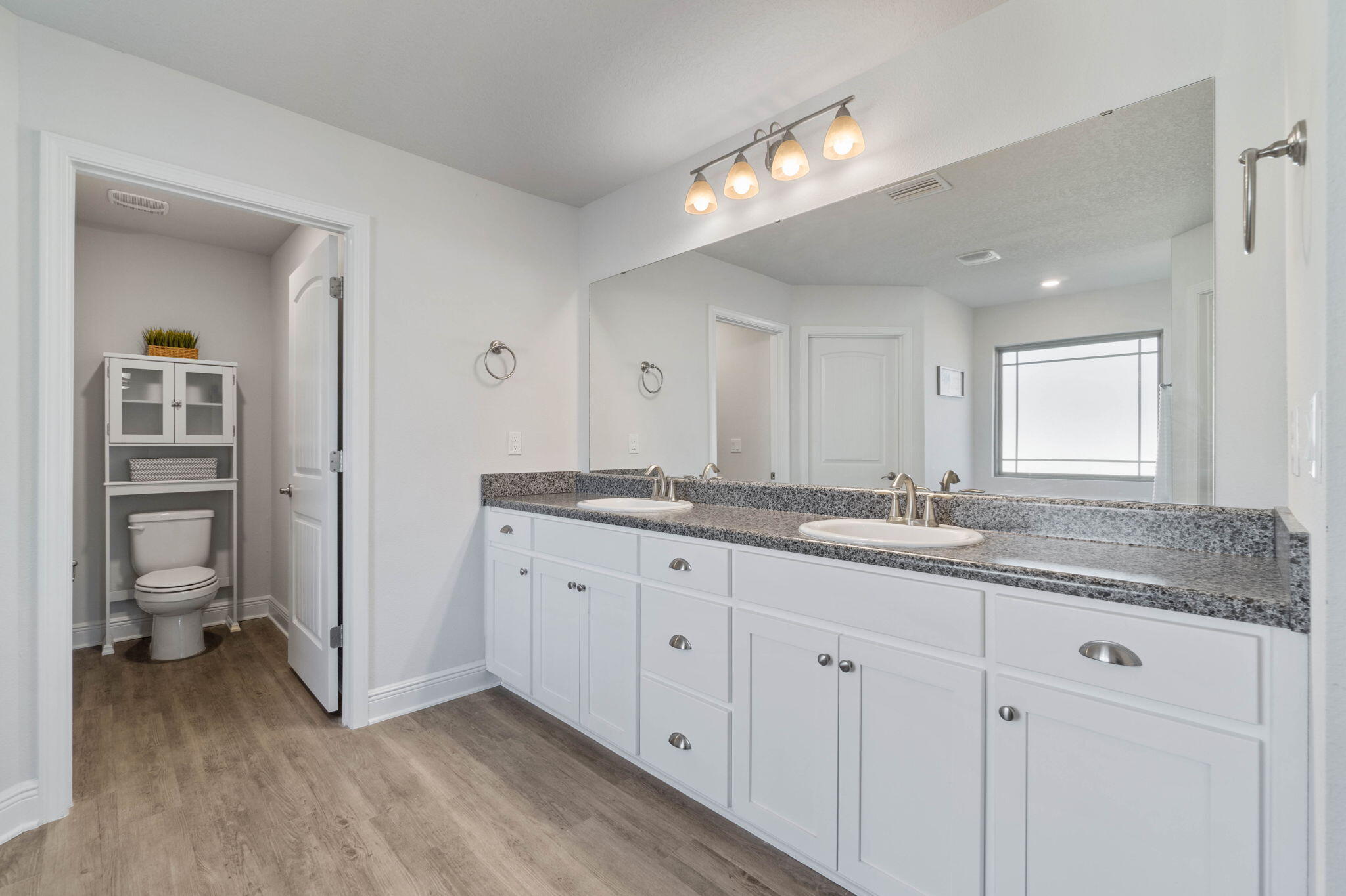 3633 Ranch Drive Crestview, FL 32539 - Photo 9 of 13 a bathroom with a granite countertop sink mirror and toilet
