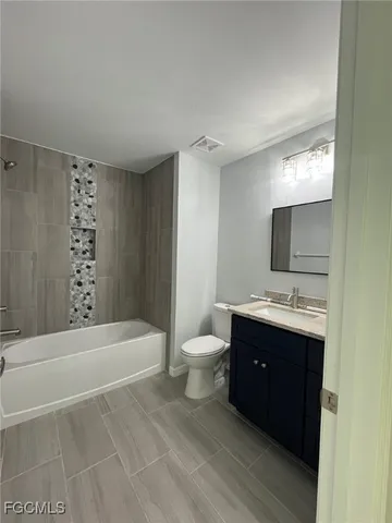 a view of livingroom and kitchen with hardwood floor