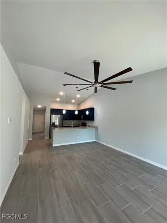 a view of a room with wooden floor