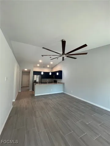 a view of a room with wooden floor