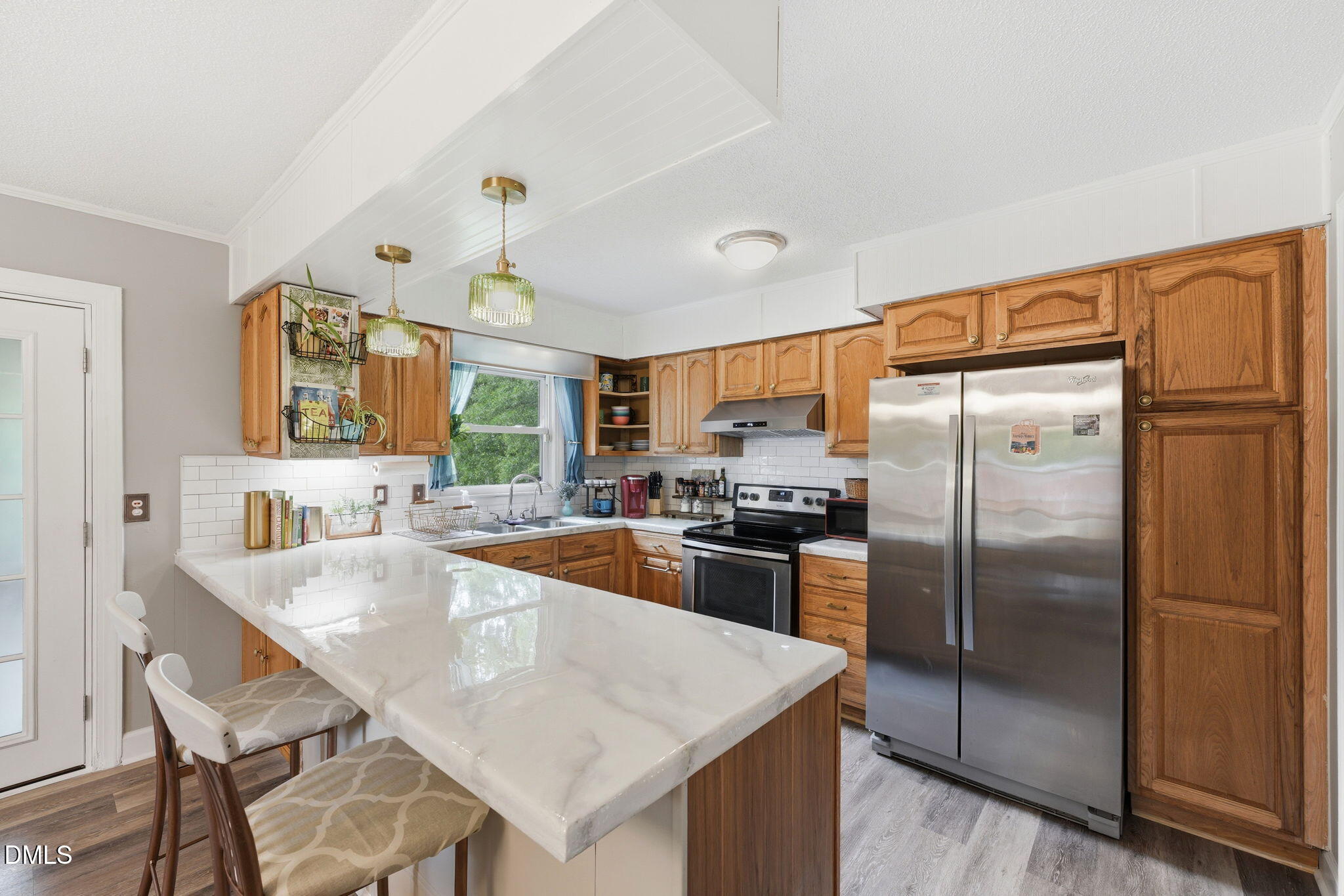 3200 Mill Creek Road Efland, NC 27243 - Photo 23 of 44 a kitchen with granite countertop a refrigerator stove and sink