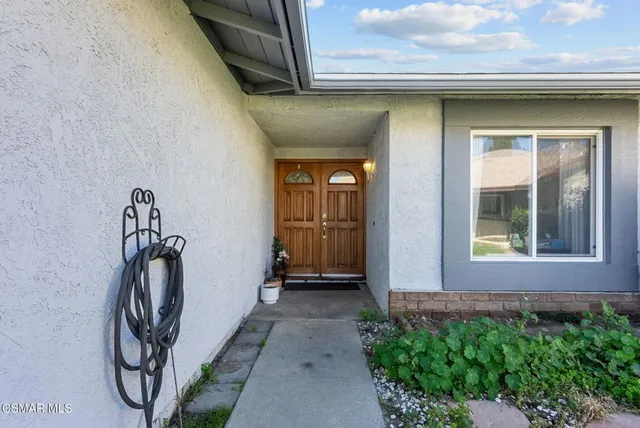 a front view of a house with a porch