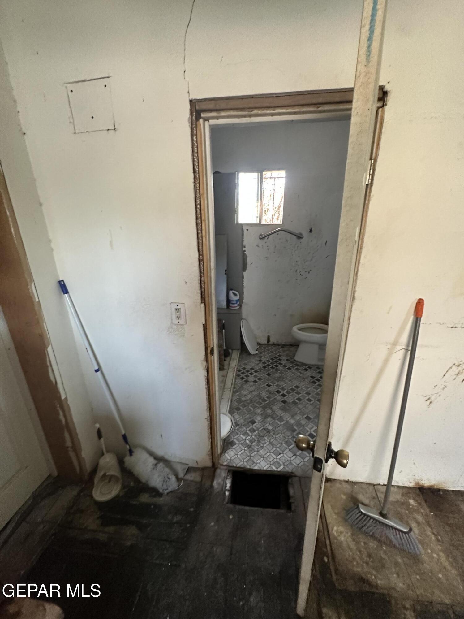 114 Fern Way El Paso, TX 79902 - Photo 6 of 9 a bathroom with a toilet and a sink