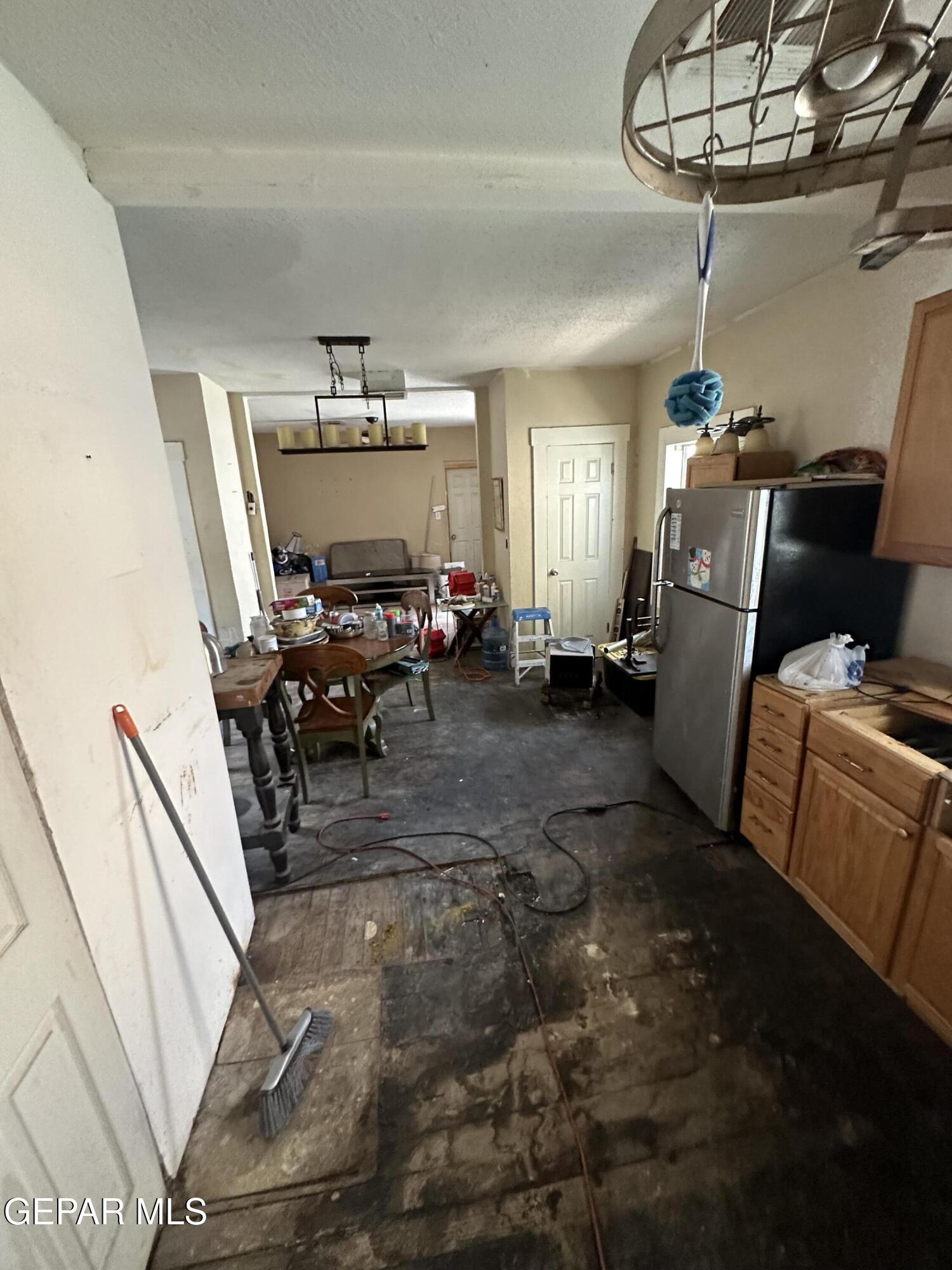 114 Fern Way El Paso, TX 79902 - Photo 7 of 9 a living room with furniture and a chandelier