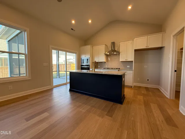 a kitchen with stainless steel appliances granite countertop a sink counter space and cabinets