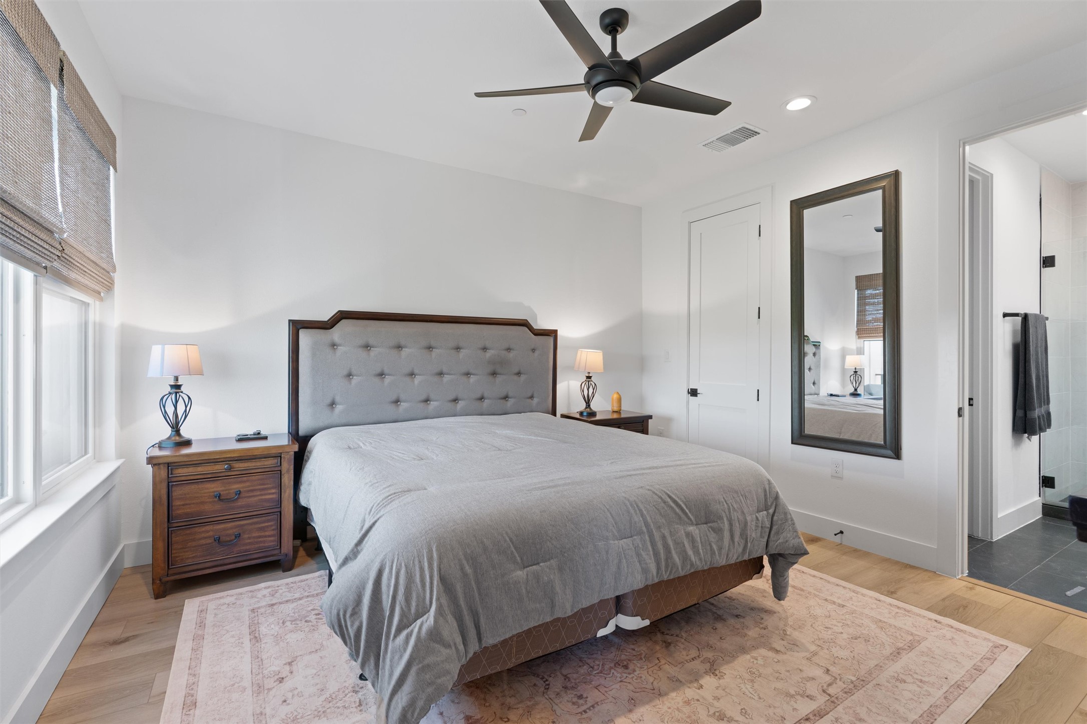 590 Old Mill Road, Unit 153 Cedar Park, TX 78613 - Photo 15 of 40 a bedroom with a bed and a chandelier